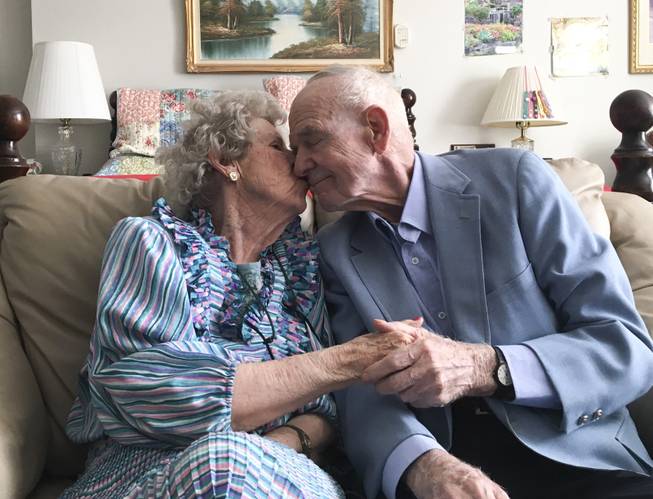 Joyce Ekstrom steals a kiss from her husband, Jim, Sunday, June 17, 2018.  They'll be celebrating their 70th anniversary on June 19.