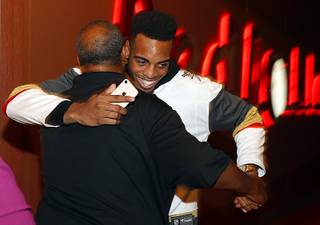 Troy Brown Jr. hugs his father after being selected by the Washington Wizards during a NBA Draft party at the Red Rock Lanes in Summerlin Thursday, June 21, 2018. The Wizards selected Brown, a Centennial High graduate, with the No. 15 pick in the NBA draft.