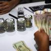 A customer buys marijuana at the Essence cannabis dispensary in Las Vegas, July 1, 2017. 