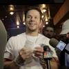 Actor Mark Wahlberg shows reporters some sports bets he placed at the Ocean Resort Casino in Atlantic City, N.J., Thursday, June 28, 2018.