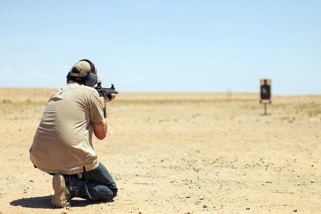 man shooting in desert