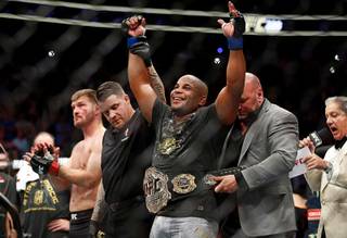 Daniel Cormier celebrates after defeating Stipe Miocic in a heavyweight title mixed martial arts bout at UFC 226, Saturday, July 7, 2018, in Las Vegas.