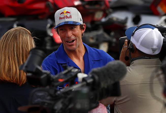 Travis Pastrana is interviewed before his first motorcycle jump, over ...