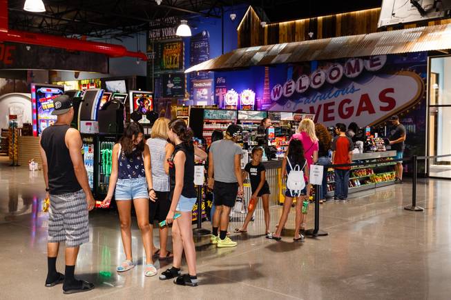 Customers wait to checkout at Terrible's Road House, the world's largest Chevron gas station, in Jean, NV, Friday, July 6, 2018.