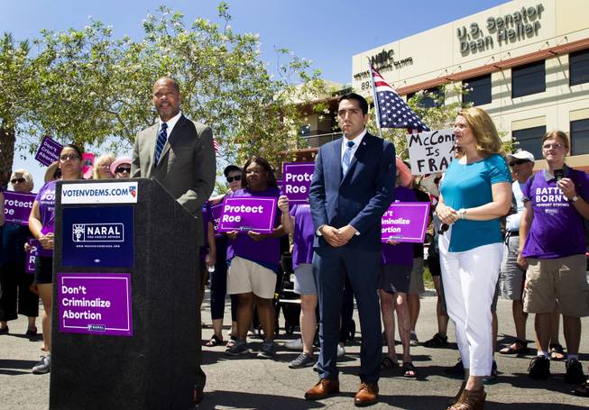 From right front, Michelle Gorelow, running for NV assembly district 35, Assemblyman Nelson Araujo, running for NV Secretary of State, look on Senator Aaron D. Ford, speaks during a NARAL Pro-choice Organization press conference held outside Dean Heller's office building in response to President Trump's SCOTUS nominee announcement, Tuesday, July 10, 2018.