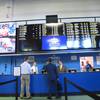 This June 14, 2018, photo shows staff at Monmouth Park racetrack in Oceanport N.J., preparing to begin taking sports bets moments before it became legal in New Jersey.