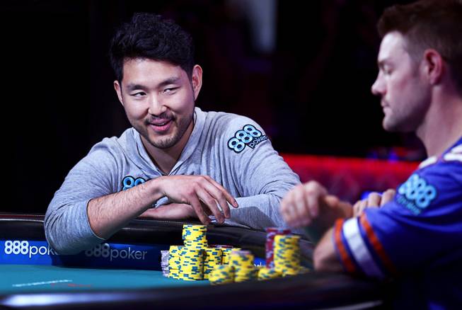 John Cynn, left, looks toward Tony Miles as they compete in the World Series of Poker Main Event at the Rio Saturday, July 14, 2018.