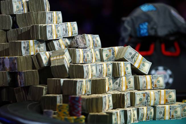 Prize money and the championship bracelet are displayed on the final table during the World Series of Poker Main Event at the Rio Saturday, July 14, 2018. The first place finisher received $8.8 million.