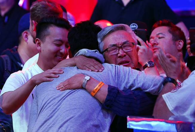 John Cynn is embraced by his father Sang Cynn after winning the World Series of Poker Main Event at the Rio Sunday morning, July 15, 2018.