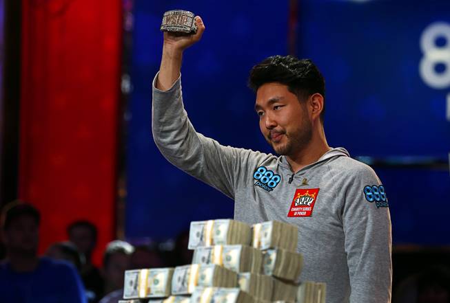 John Cynn holds up his championship bracelet after winning the World Series of Poker Main Event at the Rio Sunday morning, July 15, 2018. Cynn also won $8.8 million in prize money.