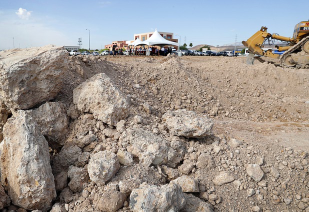 Officials gather under a tent for a groundbreaking ceremony for the first innovation building in the Harry Reid Research & Technology Park (UNLV Tech Park) on West Sunset Road near Durango Drive Tuesday, July 17, 2018.