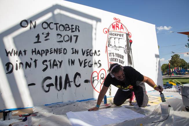 Manuel Oliver, father of Stoneman Douglas high school shooting victim Joaquin "Guac" Oliver, creates a mural that symbolizes the death of his son and a call for gun control reform during the Road to Change event organized by the March for Our Lives organization, Monday, July 16, 2018.