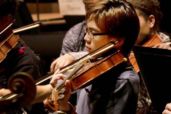 Tristin Saito is seen rehearsing in the National Youth Orchestra. 