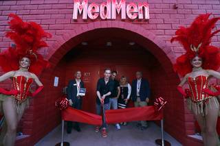 MedMen president and co-founder Andrew Modlin cuts a ceremonial ribbon during the grand opening of a MedMen marijuana dispensary, 823 S. 3rd St., in downtown Las Vegas Wednesday, July 18, 2018.