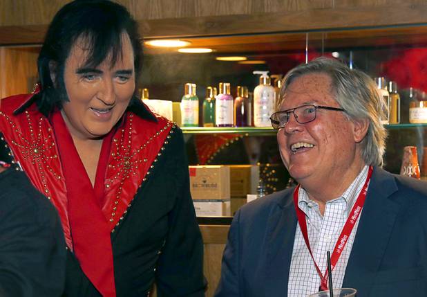 Elvis Presley tribute artist Shane Paterson chats with State Sen. Tick Segerblom, D-Las Vegas, and candidate for Clark County Commission District E, during the grand opening of a MedMen marijuana dispensary, 823 S. 3rd St., in downtown Las Vegas Wednesday, July 18, 2018.