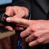 Chief Product Officer David Simpson demonstrates how a button activates the MadeSafe alert system, which identifies the location of employees in distress, at the Cosmopolitan, Wednesday, July 18, 2018.