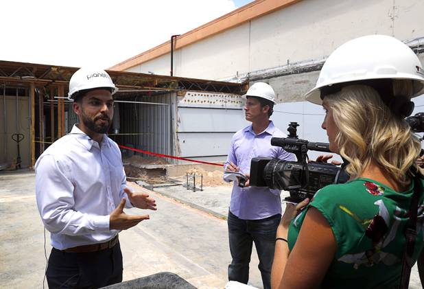 David Farris, Planet 13 director of marketing, gives a tour near the future Planet 13 entrance during a news conference for the Planet 13 Superstore dispensary, a cannabis entertainment complex, under construction on Desert Inn Road near the Strip Thursday, July 19, 2018. Phase 1, expected to be completed in November, will include an interactive entertainment space and more than 16,500 square feet of retail space.