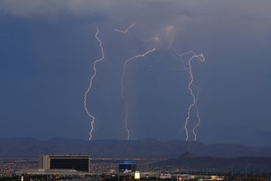 A monsoon storm cell emits lightning over the southern part of the Las Vegas valley Friday, July 20, 2018. 