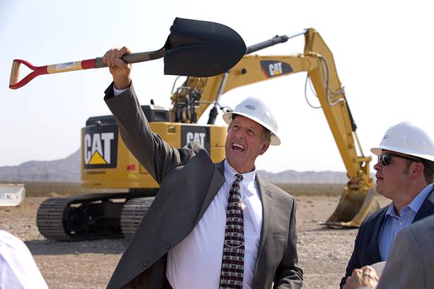 North Las Vegas Mayor John Lee holds up a shovel during a water pipeline groundbreaking ceremony near Speedway Boulevard and Centennial Parkway in North Las Vegas Tuesday, July 31, 2018. At right is pipeline partner Weston Adams. The pipeline, expected to be completed in late 2020, will jumpstart development in the Apex Industrial Park, officials said.