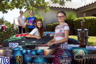 Gardiner and Gresko girls, from left, Riley Gresko, 10, Aubree Gresko, 7, Mckayla Gardiner, 13, and Alyssa Gardiner, 9, pose with their cars at the Gresko home in Henderson Saturday, Aug. 4, 2018. The family has four generations of Soap Box Derby champions. Riley recently finished third in the Stock Division in Akron, Ohio.