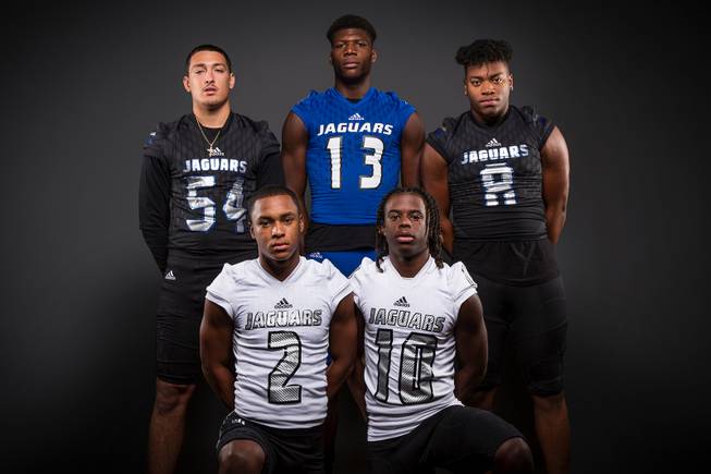 Members of the Desert Pines High football team pose for a photo at the Las Vegas Sun's high school football media day Tuesday July 31, 2018 at the Red Rock Resort and Casino. They include, top row, Gabriel Lopez, Darnell Washington, Dejon Pratt. Bottom row, Tye Moore and Devin McGee