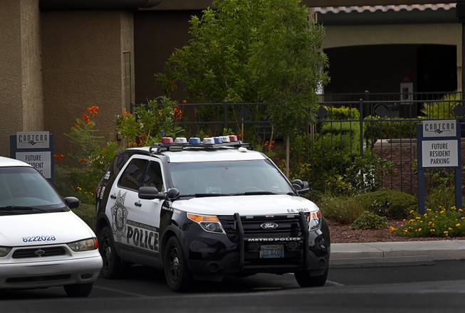 A Metro Police vehicle is shown at the Cantera At Coronado Ranch apartments, 7600 S. Rainbow Blvd., after an apparent murder-suicide Thursday, Aug. 16, 2018.