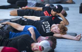Players stretch out during UNLV Hockey development camp at City National Arena Tuesday Aug. 21, 2018.