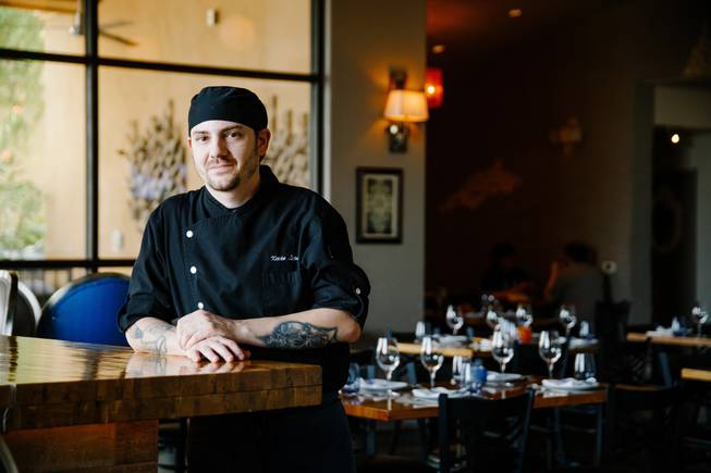 Chef Kevin Lopez poses for a photo at Andre's Bistro & Bar, Thursday, Aug. 9, 2018.
