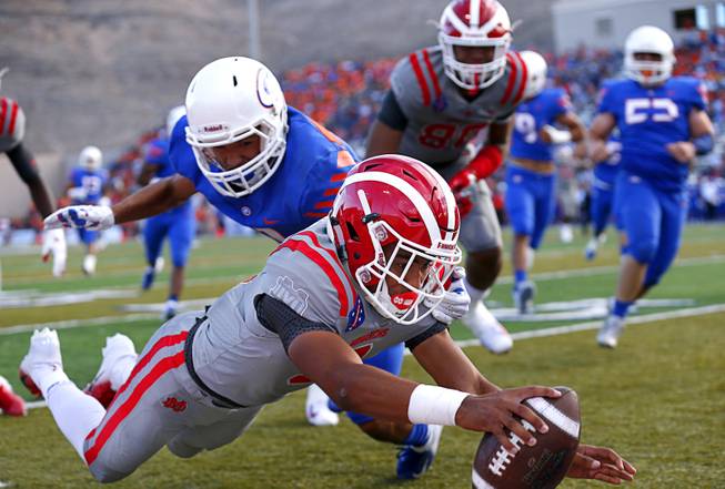 Mater Dei (Santa Ana, Calif.) quarterback Bryce Young (9) dives into the end zone for the first touchdown during a game against Bishop Gorman in Las Vegas Friday, Aug. 24, 2018.