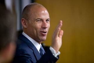 Attorney Michael Avenatti waves as he is introduced during a news conference at Battle Born Progress, a non-profit progressive advocacy organization, Friday, Aug. 31, 2018.