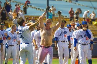 The Las Vegas 51s Peter Alonso (34) is celebrated by teammates after a game-winning home over the Sacramento River Cats for the season-ending home stand marking their final game in Cashman Field history for Triple-A professional baseball, on Monday, September 3, 2018, in Las Vegas.