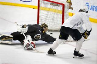 Golden Knights left wing Erik Haula (56) puts the puck into the net past goaltender Marc-Andre Fleury (29) during practice at the City National Arena in Summerlin Wednesday, Sept. 5, 2018.