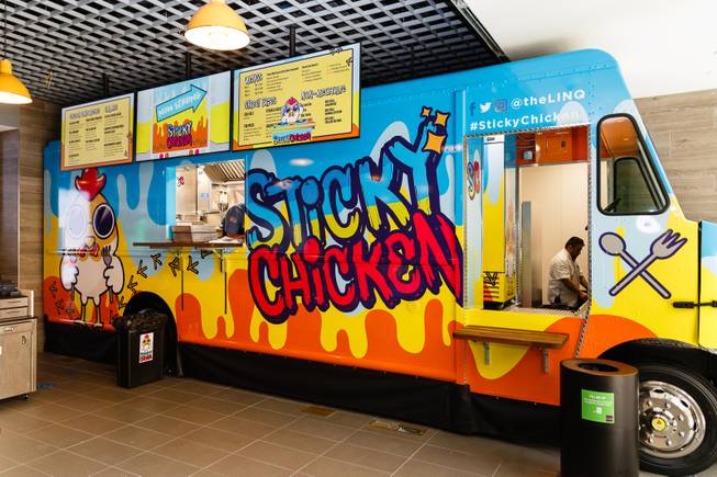 A Sticky Chicken food truck sits permanently parked at a new sports book and bar called The Book inside The LINQ, Wednesday, Sep. 5, 2018. More than 10 different wing combinations and sandwiches will be served.
