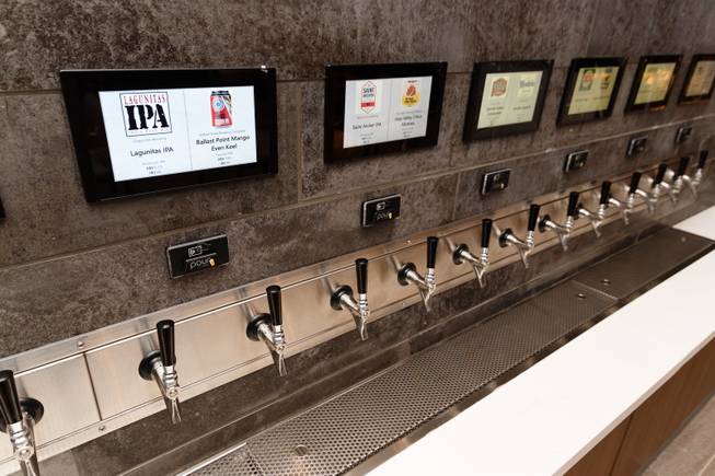A self serve beer wall with 24 taps including lagers and IPAs is seen at a new sports book and bar called The Book inside The LINQ, Wednesday, Sep. 5, 2018.