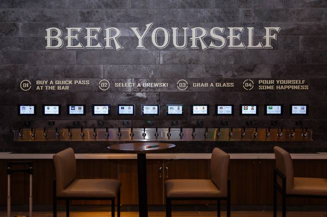 A self serve beer wall with 24 taps including lagers and IPAs is seen at a new sports book and bar called The Book inside The LINQ, Wednesday, Sep. 5, 2018.