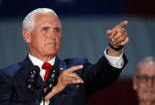 Vice President Mike Pence points to an audience member as he speaks during a visit to Nellis Air Force Base in Las Vegas Friday, Sept. 7, 2018.