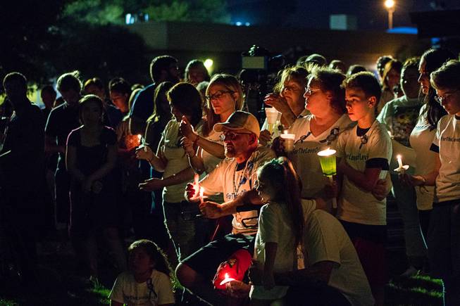Over 200 friends and family members gather during a candlelight vigil for 8-year-old Levi Echenique at Paradise Park, 4775 McLeod Dr., Sunday, Sept. 9, 2018. Echenique was killed by a suspected impaired driver in a traffic accident on Aug. 31 at at Eastern and Harmon avenues.