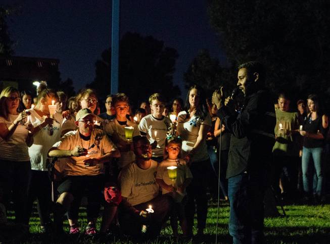 Cameron Miller speaks during a candlelight vigil for 8-year-old Levi Echenique at Paradise Park, 4775 McLeod Dr., Sunday, Sept. 9, 2018. Echenique was killed by a suspected impaired driver in a traffic accident on Aug. 31 at at Eastern and Harmon avenues.