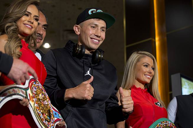 WBC/WBA middleweight champion Gennady Golovkin, center, of Kazakhstan gives two thumbs up in the lobby of the MGM Grand Tuesday, Sept. 11, 2018. Golovkin will defend his titles against Canelo Alvarez of Mexico in a rematch at T-Mobile Arena in Las Vegas on Sept. 15.