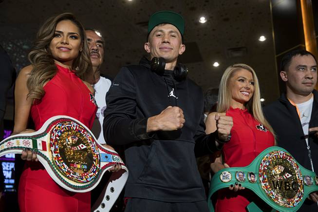 WBC/WBA middleweight champion Gennady Golovkin, center, of Kazakhstan poses in the lobby of the MGM Grand Tuesday, Sept. 11, 2018. Golovkin will defend his titles against Canelo Alvarez of Mexico in a rematch at T-Mobile Arena in Las Vegas on Sept. 15.