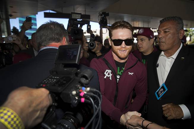 Middleweight boxer Canelo Alvarez of Mexico greets a fan as he arrives at the MGM Grand Tuesday, Sept. 11, 2018. Alvarez will challenge WBC/WBA middleweight champion Gennady Golovkin of Kazakhstan in a rematch at T-Mobile Arena in Las Vegas on Sept. 15.