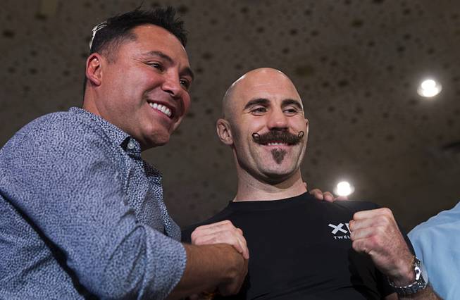 Boxing promoter Oscar De La Hoya, left, poses with middleweight boxer Gary O'Sullivan of Ireland in the lobby of the MGM Grand Tuesday, Sept. 11, 2018. Lemieux will fight Gary O'Sullivan of Ireland in a middleweight bout at T-Mobile Arena in Las Vegas on Sept. 15.