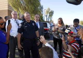Acting North Las Vegas Police Chief Justin Roberts responds to questions from reporters after a fatal shooting at a ball field at Canyon Springs High School in North Las Vegas Tuesday, Sept. 11, 2018. 