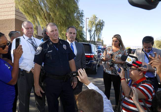 Acting North Las Vegas Police Chief Justin Roberts responds to questions from reporters after a fatal shooting at a ball field at Canyon Springs High School in North Las Vegas Tuesday, Sept. 11, 2018. 
