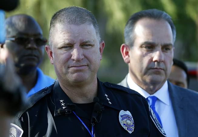 Acting North Las Vegas Police Chief Justin Roberts listens to a question from a reporter after a fatal shooting at a ball field at Canyon Springs High School in North Las Vegas Tuesday, Sept. 11, 2018. 