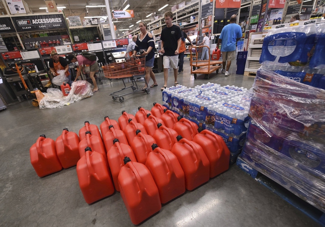 People buy supplies at The Home Depot on Monday, Sept. ...