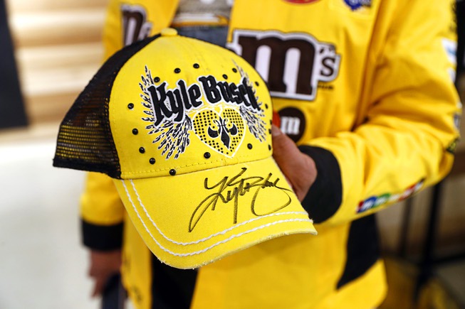 Olga Ehler shows off a cap autographed by NASCAR driver ...