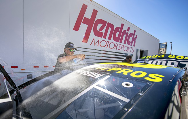 Kenny Babbert of Hendrick Motorsports is engulfed in a cloud ...