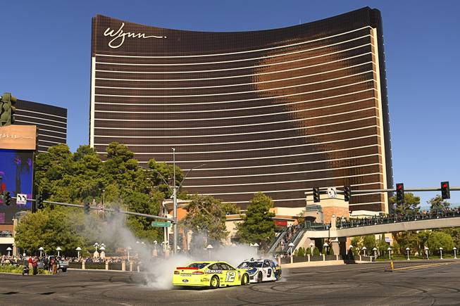 Ryan Blaney (12) and Chase Elliott (9) go nose-to-nose for their burnout during the 2018 NASCAR Burnout Blvd event on the Las Vegas Strip at Spring Mountain Road Thursday, September 13, 2018. The event kicks off the Fall NASCAR Weekend at the Las Vegas Motor Speedway being held September 13-16. Sam Morris/Las Vegas News Bureau