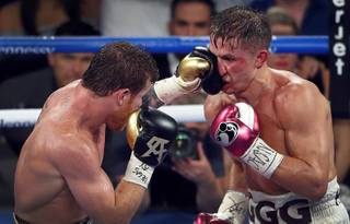 Canelo Alvarez, left, of Mexico lands a punch on WBC/WBA middleweight champion Gennady Golovkin of Khazakstan during their title fight at T-Mobile Arena Saturday, Sept. 15, 2018. Alvarez took Glolovkin's WBC/WBA titles by majority decision. STEVE MARCUS